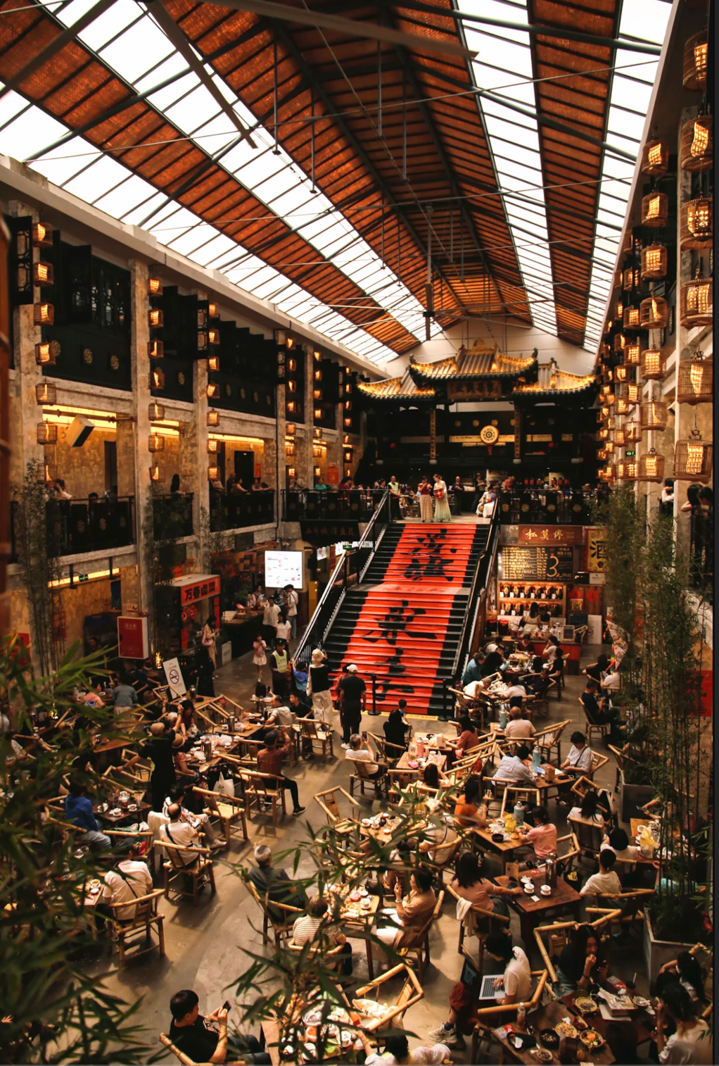A large Chongqing dining hall with warm lanterns and local tables