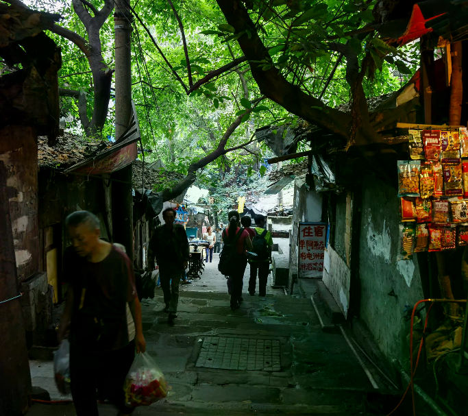 A lived-in Chongqing lane connecting infrastructure with daily life