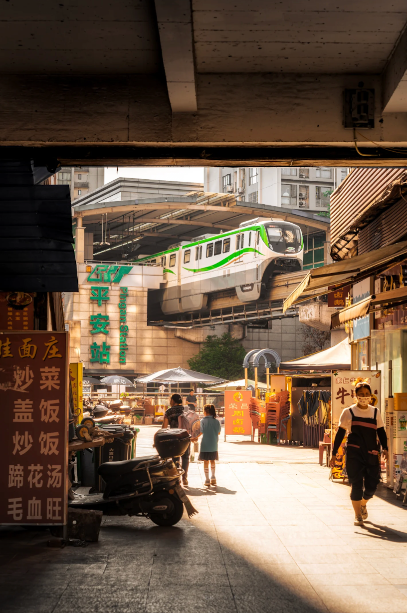 A neighborhood market beneath Chongqing rail infrastructure