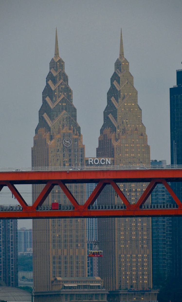 Red bridge, cable car and layered architecture in Chongqing